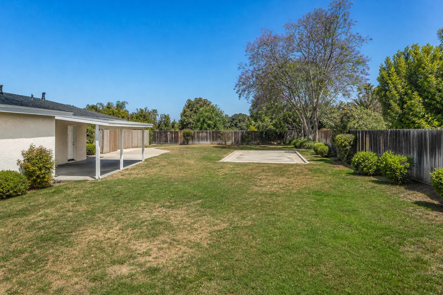 Large rear yard of Freedom Tract home showing lot size and ADU development potential in Westside Costa Mesa.